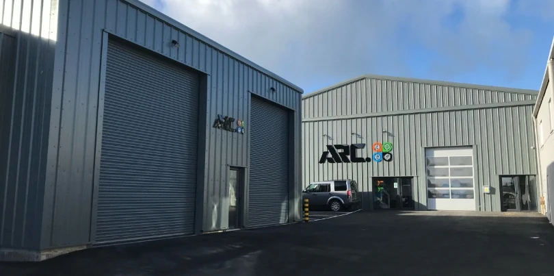 Photo of ARC's Body Shop Site with its logo on the exterior wall